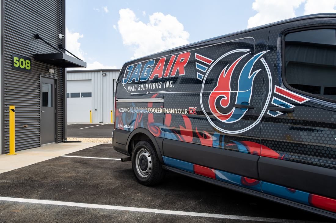 Full vehicle wrap with wrapped curves and detailed graphics installed by Good Graphics Co. for JagAir HVAC Solutions.