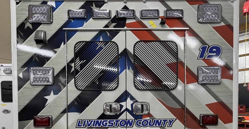 Close-up of diagonal reflective conspicuity striping showing sealed edges and precise alignment, installed by Good Graphics Co.